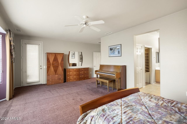 bedroom with light carpet, connected bathroom, and ceiling fan