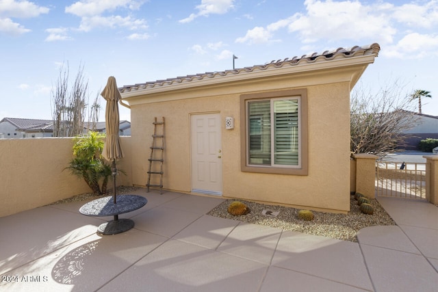 doorway to property featuring a patio