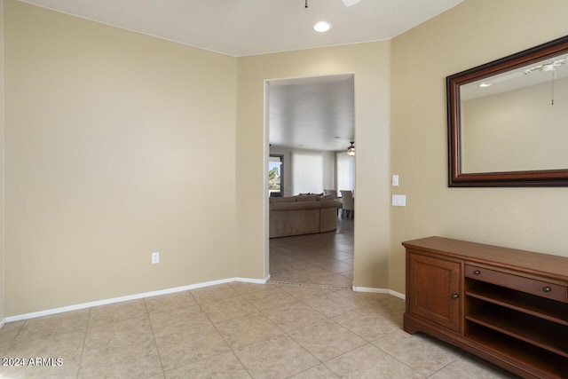 hallway with light tile patterned floors