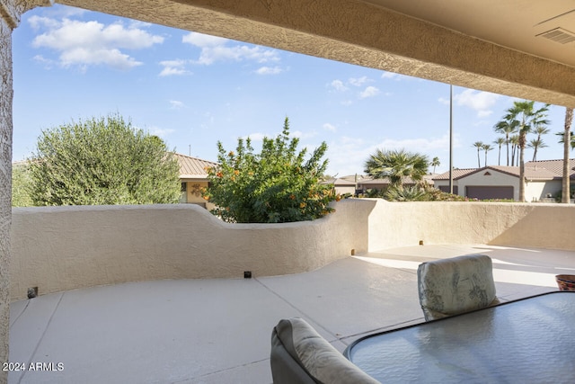 view of patio / terrace with a balcony