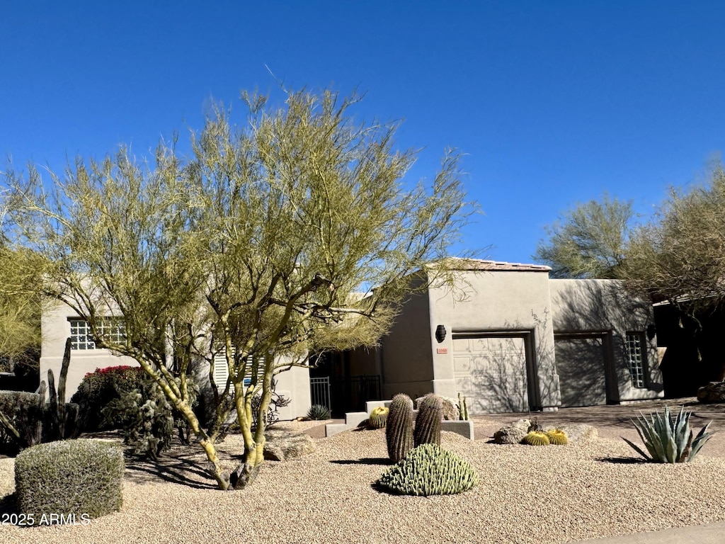 view of side of property featuring a garage