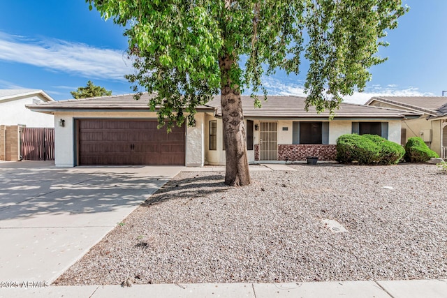 560 E San Pedro Ave, Gilbert, AZ 85234 - ranch-style house with an attached garage, concrete driveway, a tiled roof, stucco siding, and fence