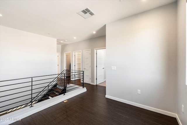 hall with dark hardwood / wood-style flooring