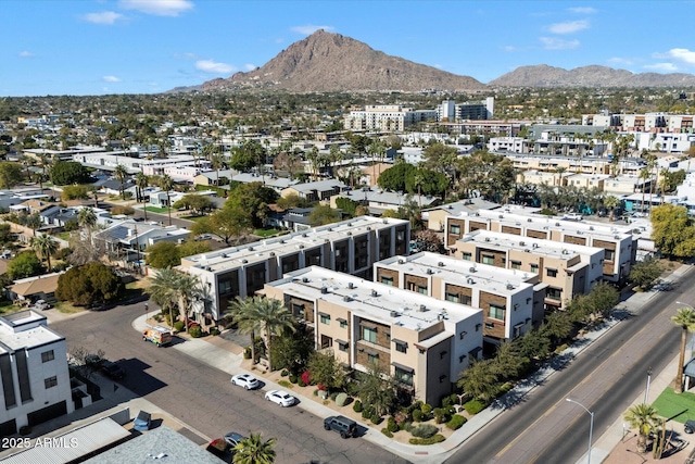 birds eye view of property featuring a mountain view