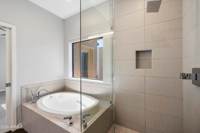 bathroom featuring separate shower and tub