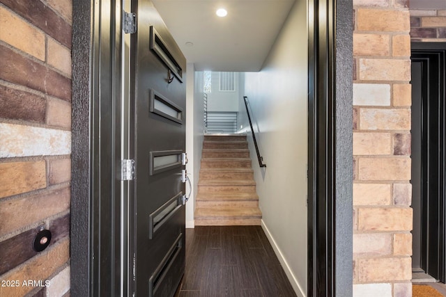 stairway featuring hardwood / wood-style flooring