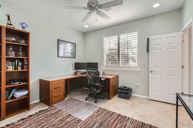 office featuring baseboards, light tile patterned flooring, and a ceiling fan