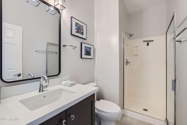 full bath featuring vanity, a shower stall, and toilet