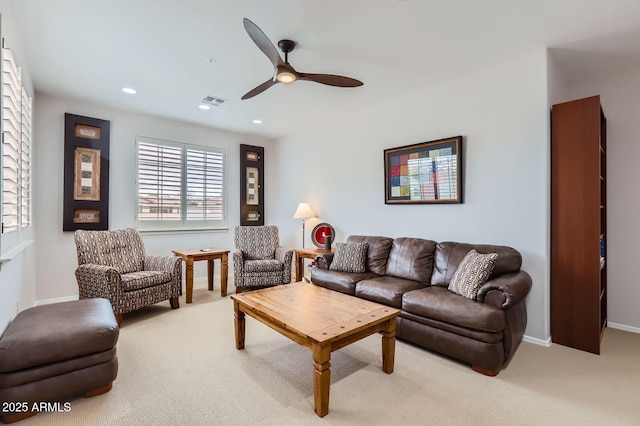 living room with recessed lighting, visible vents, light colored carpet, and ceiling fan