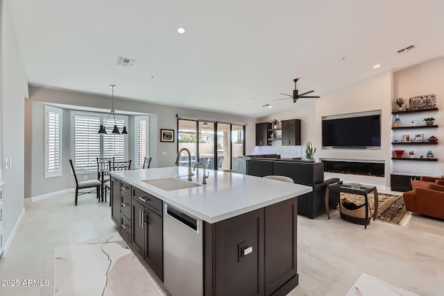 kitchen with visible vents, dishwasher, ceiling fan, and a sink