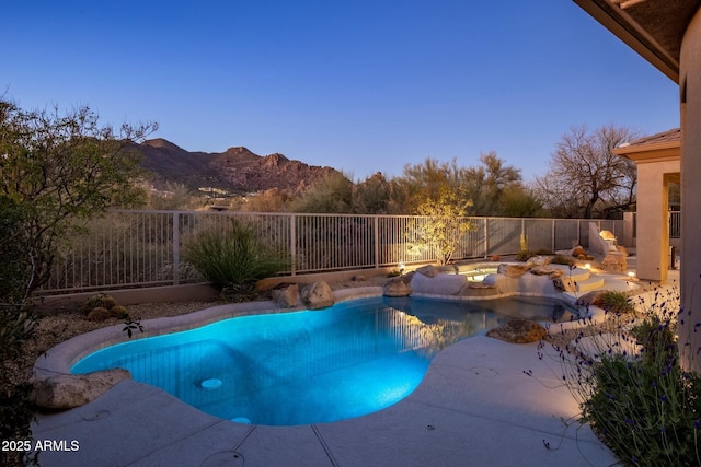 view of swimming pool with a fenced in pool, a fenced backyard, a mountain view, and a patio