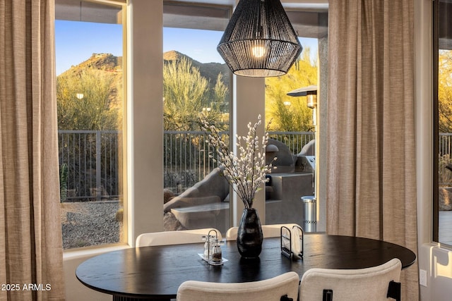 dining area featuring a mountain view