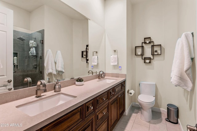 full bathroom with tile patterned floors, a sink, toilet, and a shower stall