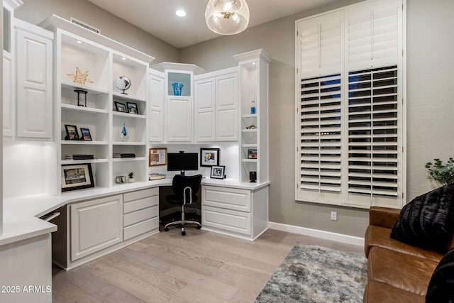 office area with built in desk, light wood-type flooring, and recessed lighting