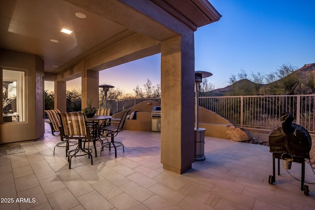 view of patio / terrace featuring outdoor dining area, fence, and area for grilling