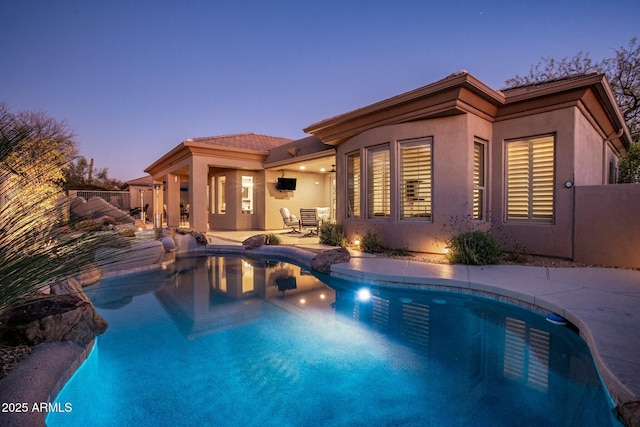 view of pool featuring a fenced in pool and a patio area