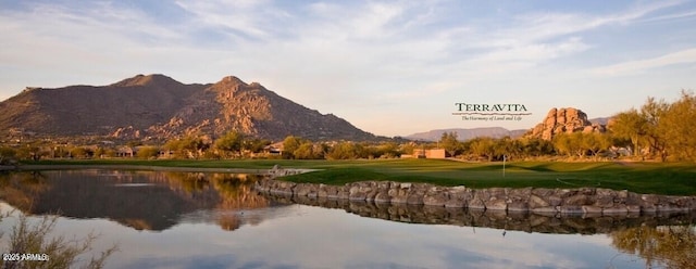 mountain view with view of golf course and a water view