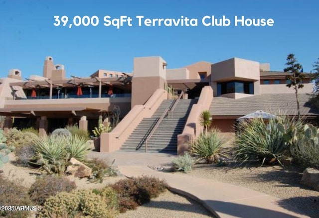 view of front of house featuring stucco siding