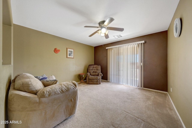 1384 S 222nd Ln, Buckeye, AZ 85326 - carpeted living room with a ceiling fan and baseboards