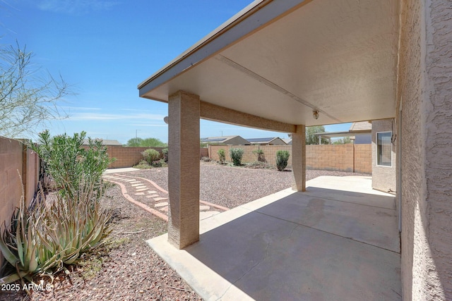 1384 S 222nd Ln, Buckeye, AZ 85326 - fenced backyard with a patio area