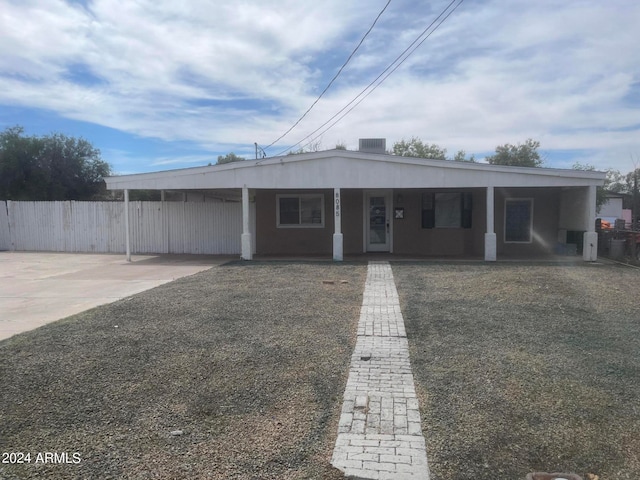 view of front facade with a carport