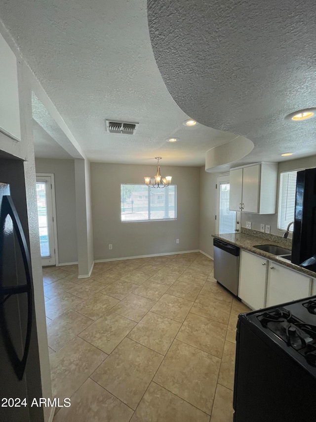 kitchen with white cabinets, sink, dishwasher, and a wealth of natural light