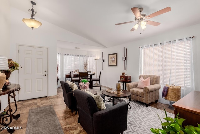 living room with ceiling fan and vaulted ceiling