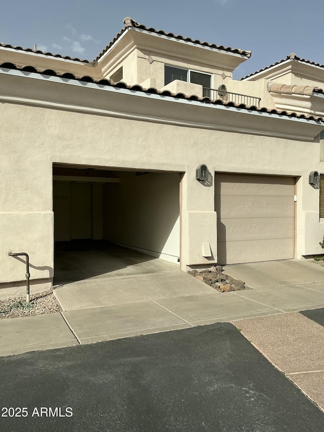 garage with concrete driveway