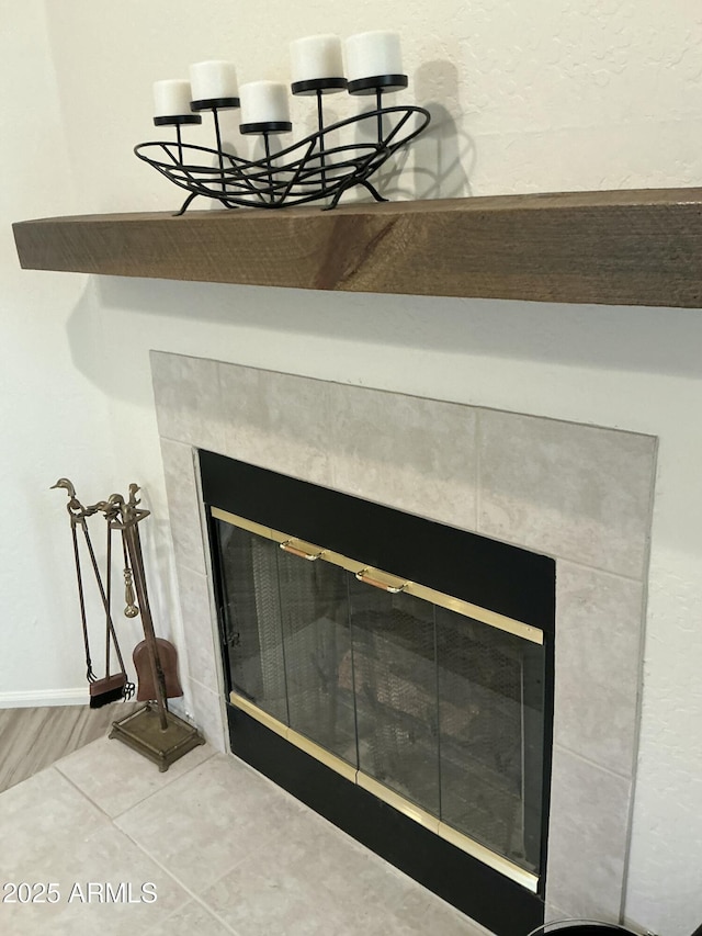 interior details with a fireplace and baseboards