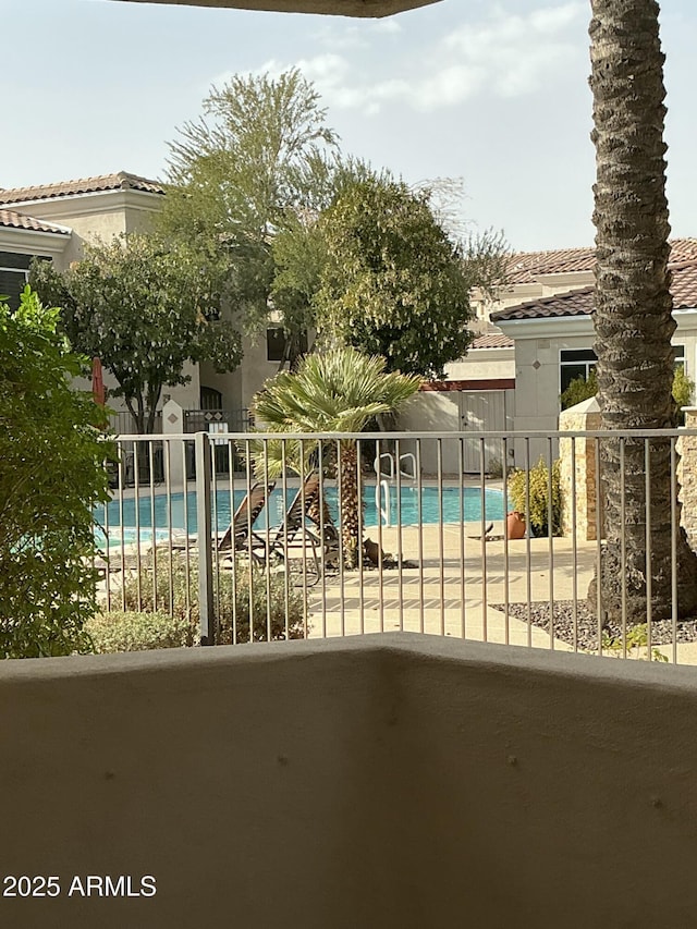 view of pool featuring a fenced in pool, fence, and a patio