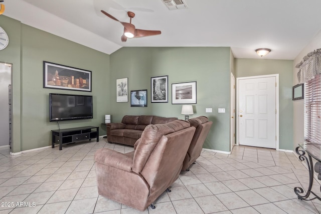 living room with light tile patterned flooring, lofted ceiling, visible vents, and a ceiling fan