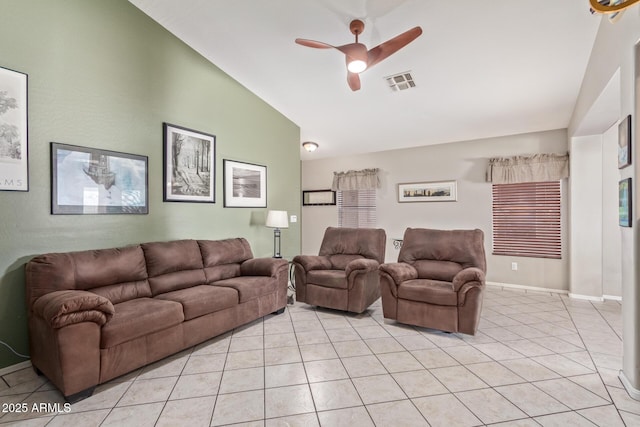 living area with light tile patterned floors, ceiling fan, baseboards, lofted ceiling, and visible vents