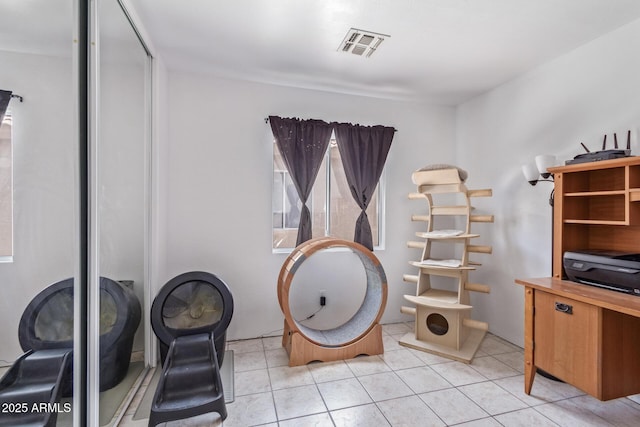 interior space with visible vents and light tile patterned floors
