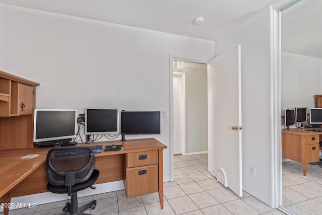 home office featuring light tile patterned floors