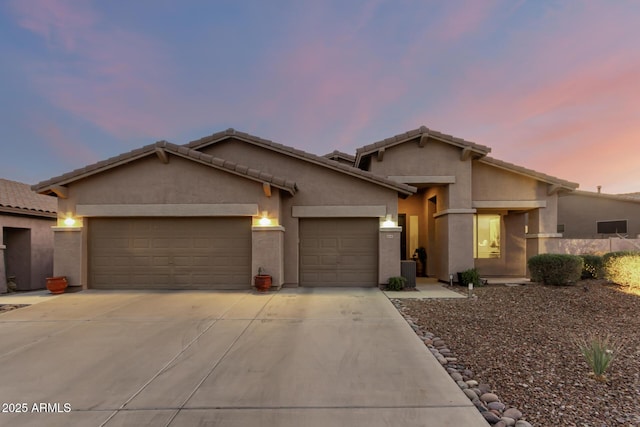 view of front of property with a garage