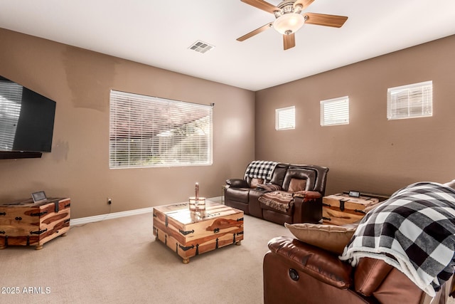 carpeted living room featuring ceiling fan