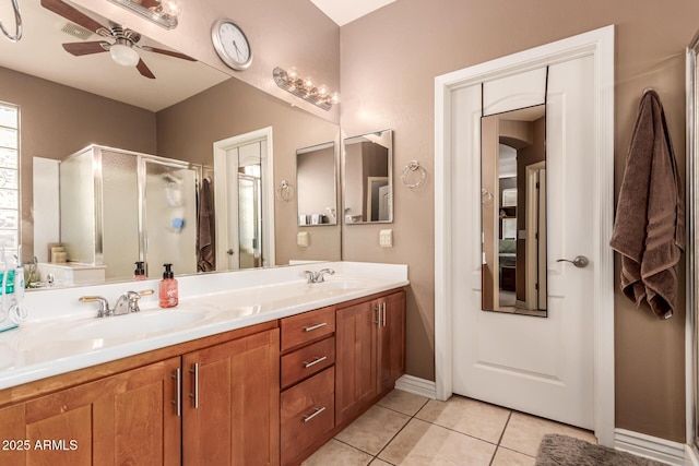 bathroom with tile patterned flooring, vanity, ceiling fan, and a shower with shower door