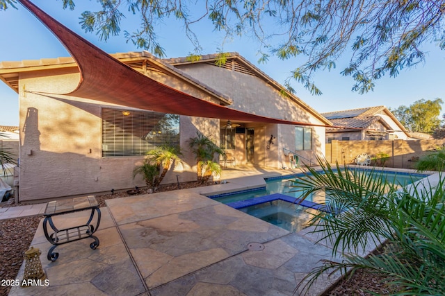 view of pool featuring an in ground hot tub and a patio