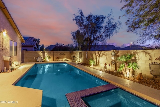 view of pool at dusk