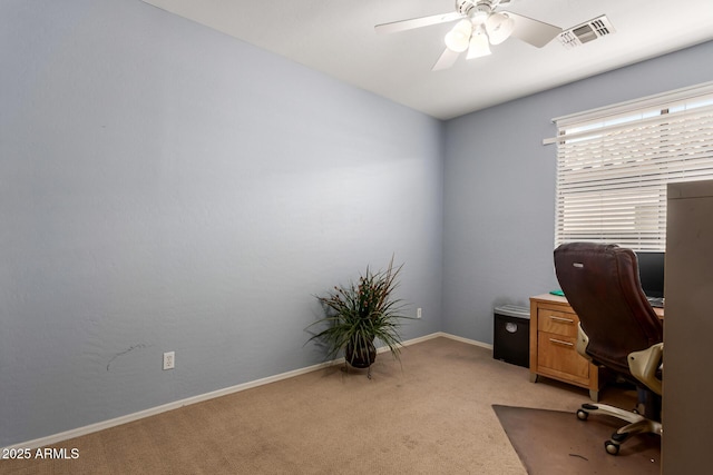 carpeted office with ceiling fan