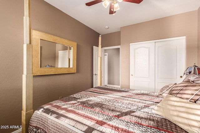 bedroom featuring ceiling fan and a closet