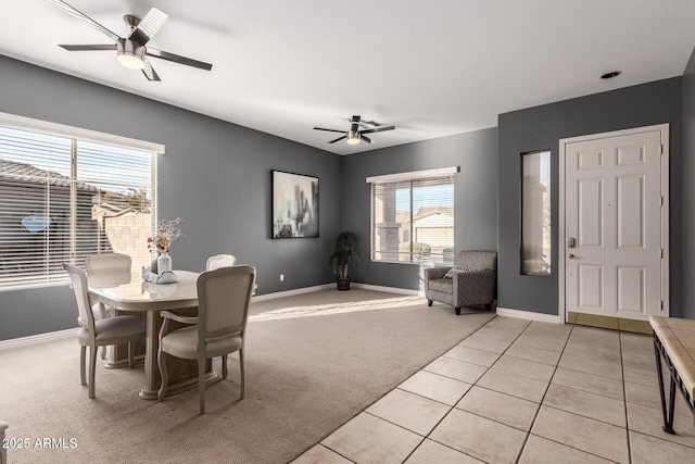 dining room featuring light tile patterned floors and ceiling fan