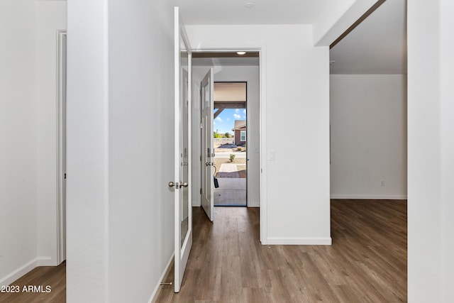 hall with hardwood / wood-style floors