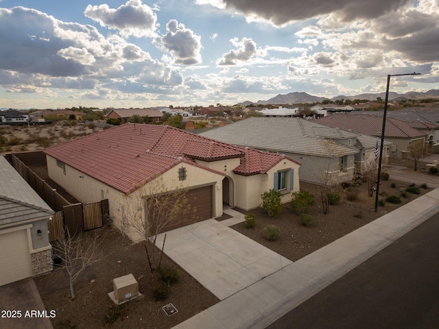 birds eye view of property featuring a mountain view