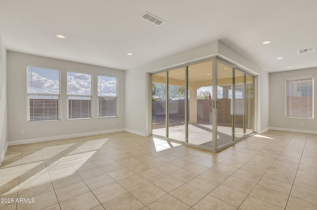 empty room with light tile patterned floors