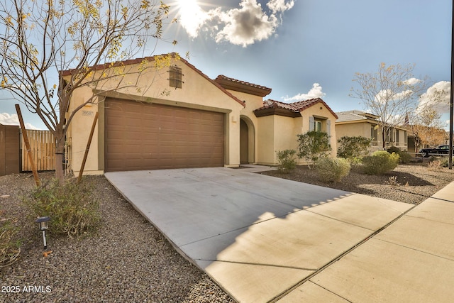 mediterranean / spanish-style home featuring a garage