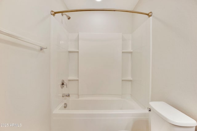 bathroom featuring toilet and shower / bathing tub combination