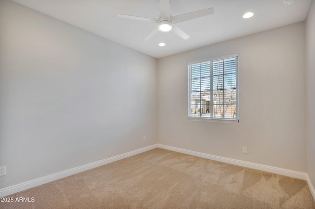 spare room featuring carpet and ceiling fan