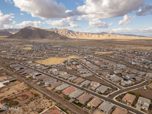 birds eye view of property with a mountain view