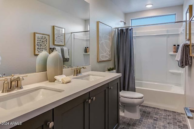 full bathroom featuring toilet, shower / bath combo, and vanity